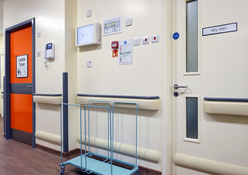 Warrington Hospital's Forget Me Not Ward features a bold, contrasting colour scheme within patient toilets to make them easy to find, while utility doors have been kept in the same colour as surrounding walls to make them blend in