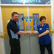 Bioquell Sales Manager Sam Burroughes cuts the ribbon with Ann Rowley, Deputy Ward Manager