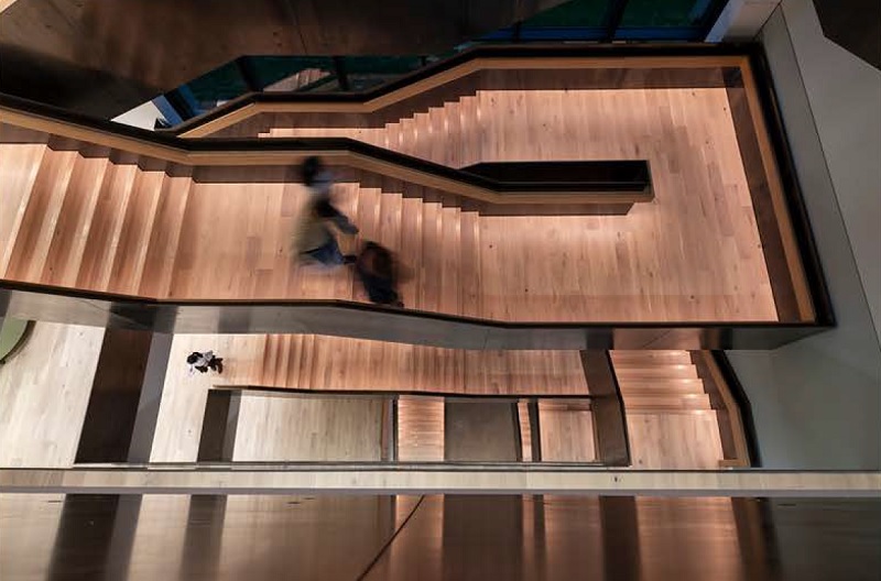 A feature staircase runs the full height of the building in a single sweep