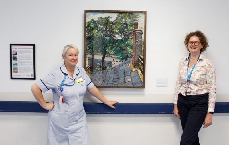 Staff with View from the Studio by Edward Beale, part of a new art exhibition at Luton and Dunstable University Hospital
