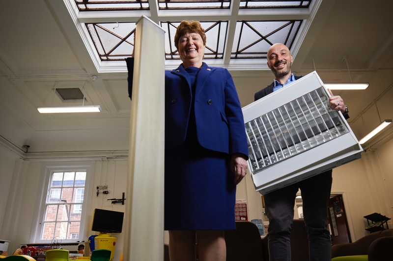 Mark Foden and Kathy Cowell OBE DL, Chairman of Manchester University NHS Foundation Trust, with the old light fittings
