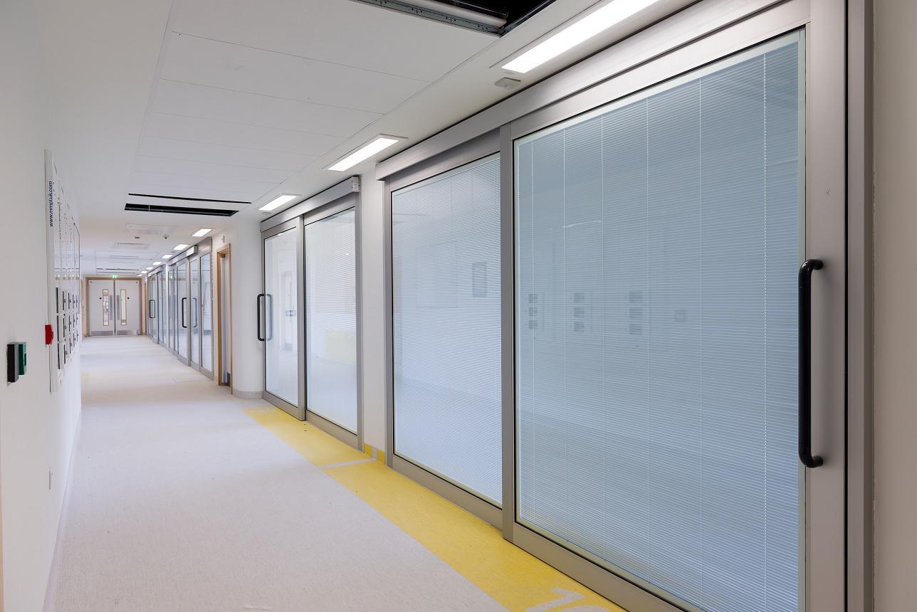 The AXIS Flo-Motion manual sliding door was designed specifically for the development