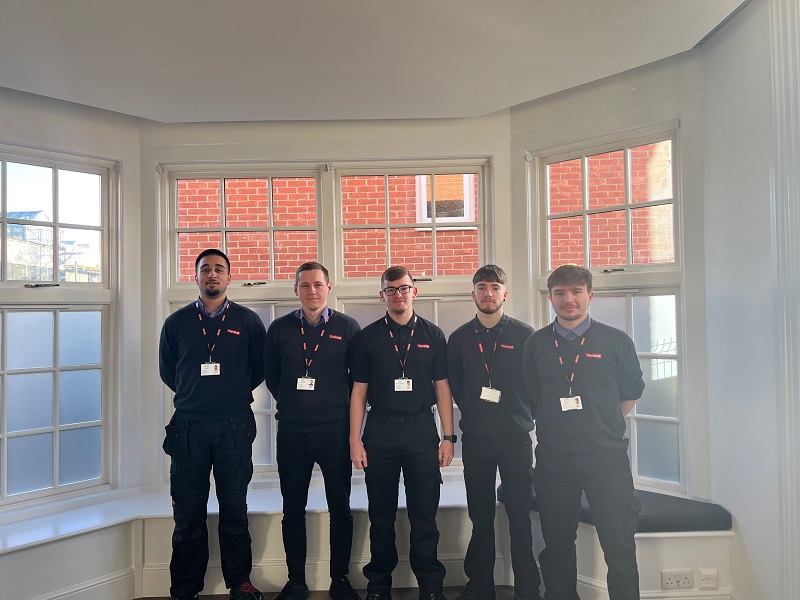 The five apprentices have accepted full-time roles after three years training with Tunstall Healthcare