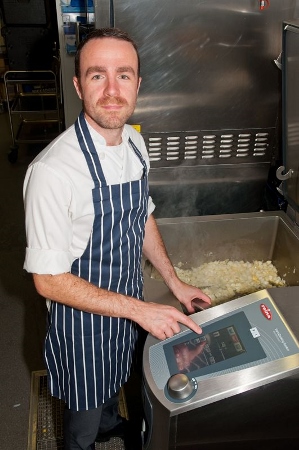 Busy hospital kitchen designed around multi-functional, space-saving cooking appliance