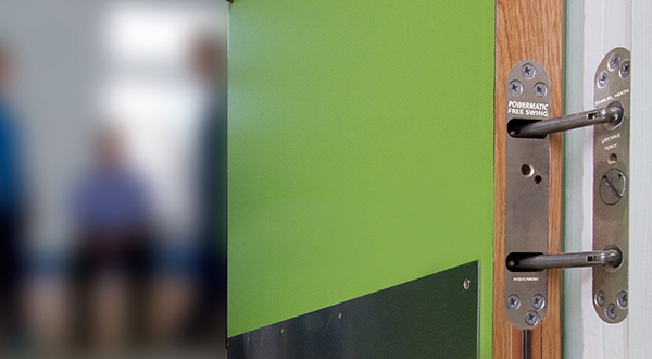 Free-swing door closers at new mental health hospital