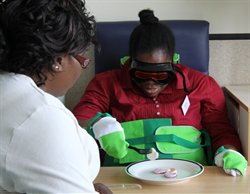 STAFF at Guy's and St Thomas' in age simulation suit