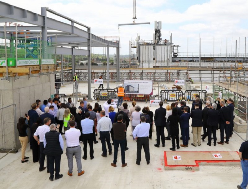 Guests watched the final piece of steel lifted into place