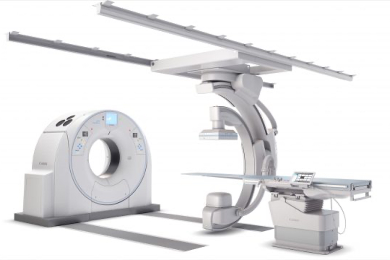 Why must new interventional radiology systems move the system, not the patient?